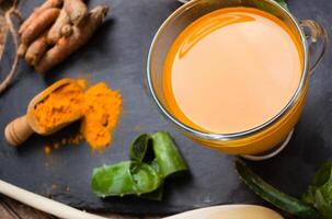 Tumeric and turmeric tea with spices photo