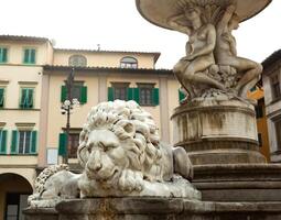 Marble lions of the fountain located in Farinata degli Uberti Square in Empoli photo