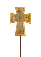 A wooden cross with religious paintings on it photo