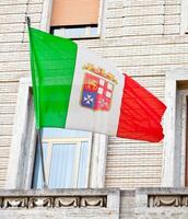 Italy flag on a building in rome, italy photo