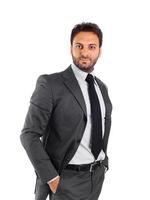A man in a suit and tie posing for the camera photo