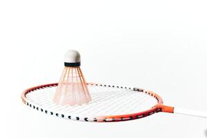 Badminton racket and shuttlecock isolated on white background, close-up shot. high quality image for photo