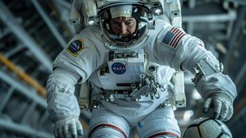 An astronaut in a spacesuit at a spaceport before a flight. Astronaut against the background of the rocket photo