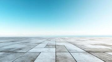 Vast open space with concrete pavement against a serene blue sky, ideal for backgrounds or modern designs. photo