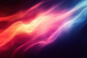 Abstract fluid wave pattern in vibrant colors of pink, red, and blue on a dark background. photo