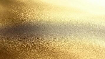 Close-up of a shimmering gold texture with soft light reflections. photo