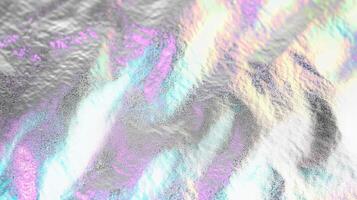 Abstract holographic texture with vibrant colors on a reflective surface. photo