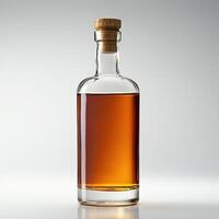 Glass bottle with amber liquid, cork top, isolated on white background. photo