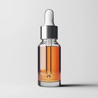 Essential oil dropper bottle, perfect for wellness and skincare, against a white isolated background. photo
