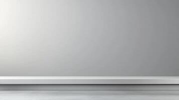 Minimalist gray wall with a white shelf, ideal for displaying products or artwork. photo