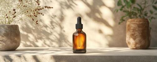 Amber glass dropper bottle on a minimalistic surface with decorative vases and soft shadows. photo