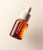 Amber glass dropper bottle with white cap, floating against a soft beige background. photo