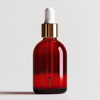 Red glass dropper bottle with white dropper cap, isolated on white background. photo