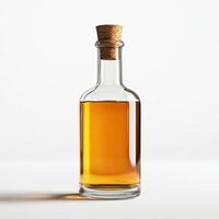 Clear glass bottle with cork, filled with amber liquid, isolated on white background. photo