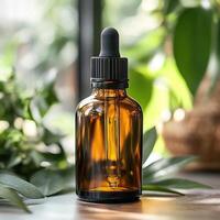 Amber glass dropper bottle on a table surrounded by green plants. photo