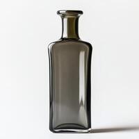 Elegant dark glass bottle on a white isolated background perfect for packaging or decoration. photo