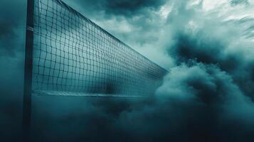 Volleyball net shrouded in mist, creating an atmospheric and dramatic sports scene. photo