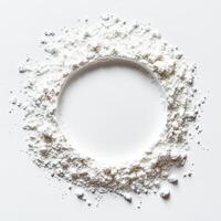 Fine white powder arranged in a circular frame on a clean surface. photo