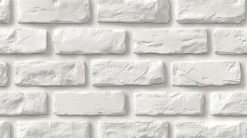 Textured white brick wall with a smooth finish, ideal for backgrounds and design projects. photo