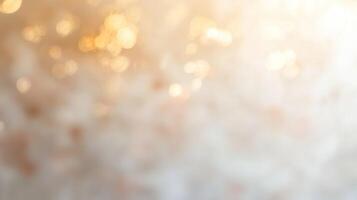 Soft peach and ivory watercolor background with golden bokeh photo