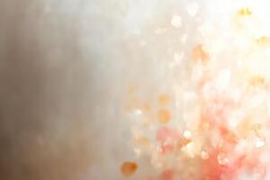 Soft peach and ivory watercolor background with golden bokeh photo