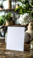 a white blank invitation in portrait 5x7 mockup scene ,with focus on the invitation photo