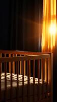 Cozy nursery with a wooden crib illuminated by warm, golden sunlight streaming through a window. photo