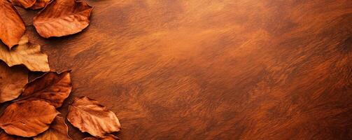 Autumn leaves on a wooden table surface, showcasing warm colors and textures. photo