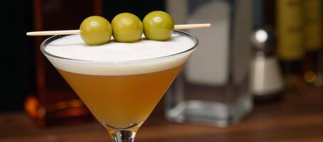 Martini with olives in classic glass perfect for barsparties or menus photo