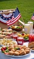 Festive picnic featuring American flagthemed decorations food and beverages photo