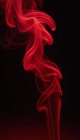 Abstract red misty fog on an isolated black backdrop evokes the texturerich atmosphere of smoke stages captures the essence of aromatherapy through visual storytelling Smoky Aroma Studio photo