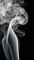 Abstract paranormal misty smoke against an isolated black backdrop textured with overlay effects to create eerie cloudlike forms for movie scene imagery photo