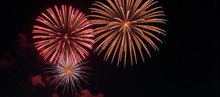 Stunning firework display featuring vivid colors exploding against a starry night sky photo