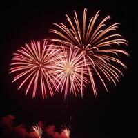 Stunning firework display featuring vivid colors exploding against a starry night sky photo