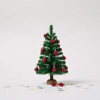 White background adorned with green confetti and red ornaments around a miniature Christmas tree photo
