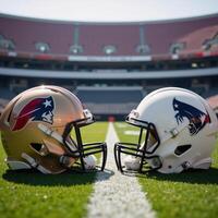 Two American Football Helmets facing off against one another atop a gridiron within a Stadium setting photo