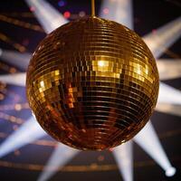 A golden disco ball adds an elegant shimmery radiance to party settings photo