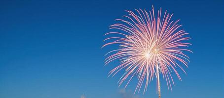 Stunning daytime firework show with vibrant hues set against a clear blue sky Copy Space Image photo