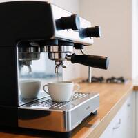 Closeup image of modern espresso machine inside a kitchen photo