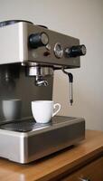 Closeup image of modern espresso machine inside a kitchen photo
