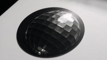 Monochrome photograph of a shimmering discoball decal photo