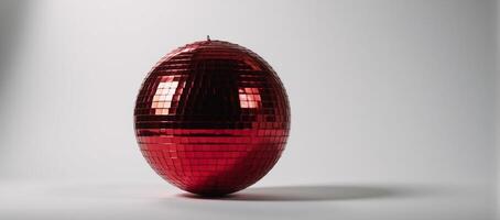 Isolated red disco ball glows against blank canvas backdrop photo
