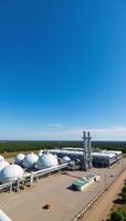 A panoramic view of an industrial landscape with chemical plants and spherical reservoirs showcasing the surrounding chemical waste storage areas and advanced industrial technology in a detailed 3D photo