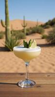 Cactusinfused Margarita served amidst a desert backdrop featuring cactus fruit lime garnish photo