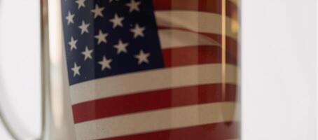 Closeup minimalist drawing highlighting the symbolic contrast between an American flag reflection and a frosty beer mug photo