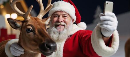 Smiling Santa Claus takes a selfie with reindeers photo