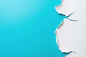 A hole in a wall with a blue background photo