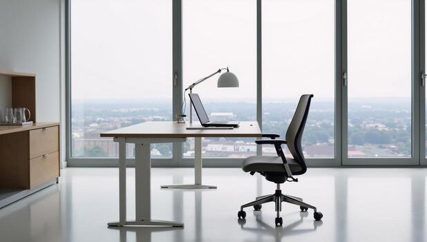 a modern office environment centered around a large window and desk setup photo