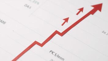 Minimalistic Chinese stock market chart highlights upward trend on red line financial data and charts in background photo