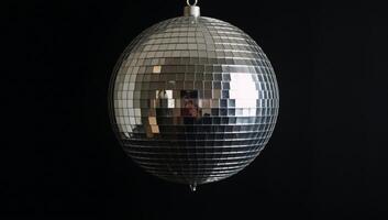 Disco ball isolated against minimalistic backdrop photo